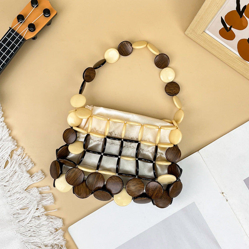 Aurelia – Perlmutt-Handtasche mit Holz-Akzenten