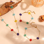 Jolie – Farbenfrohe Taillenkette mit Blumen-Akzenten